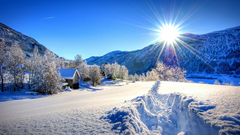 Snow-covered Cabin in Valley