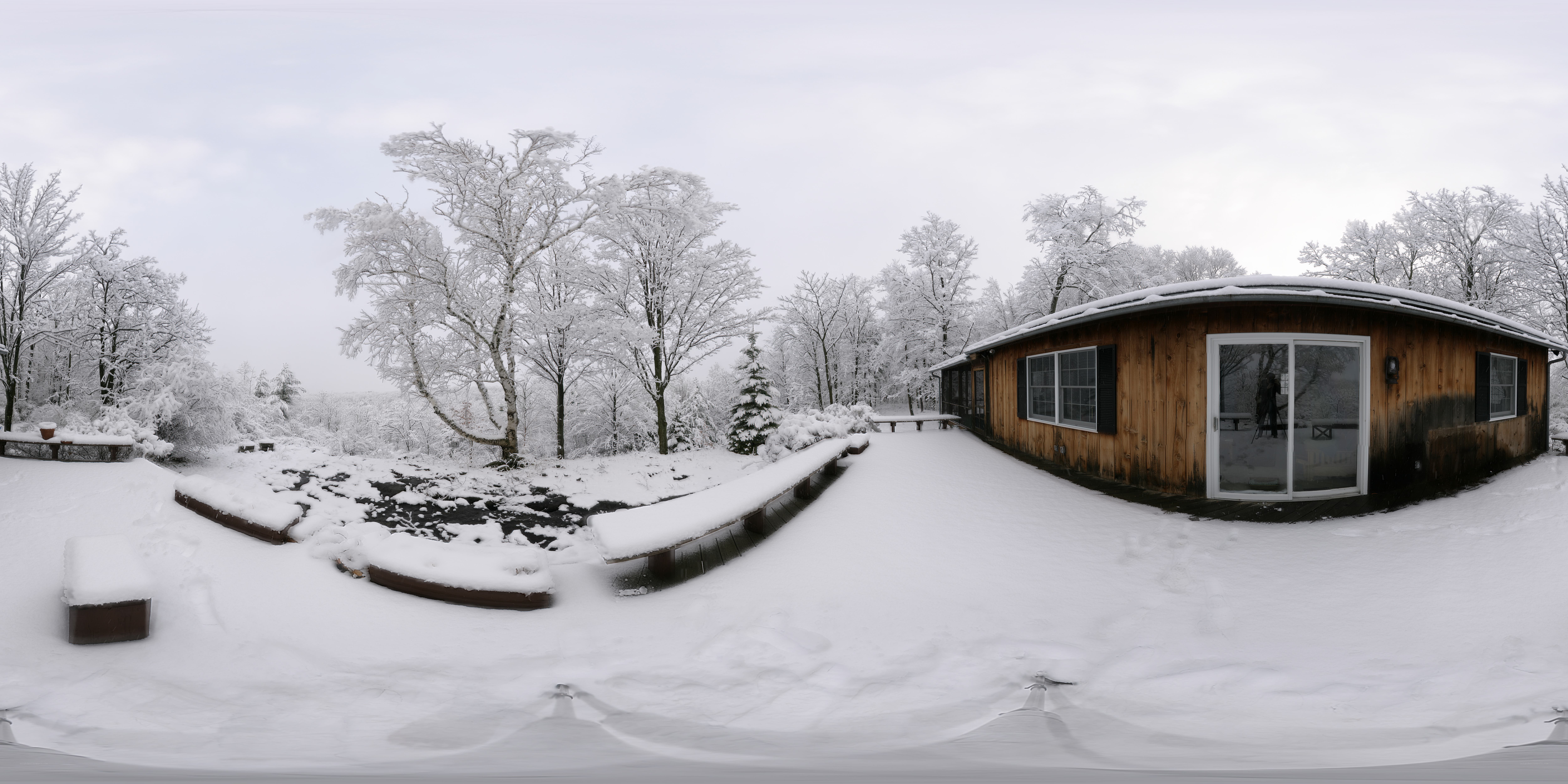 Snow-covered cabin in winter
