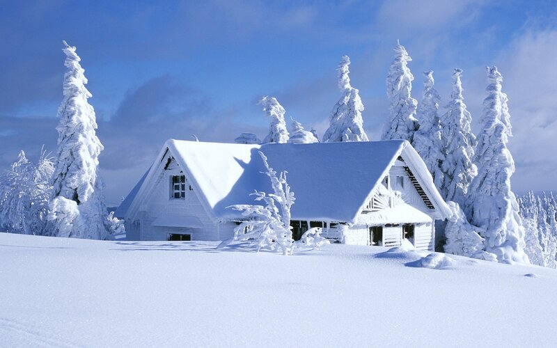 Snow-covered cabin in winter