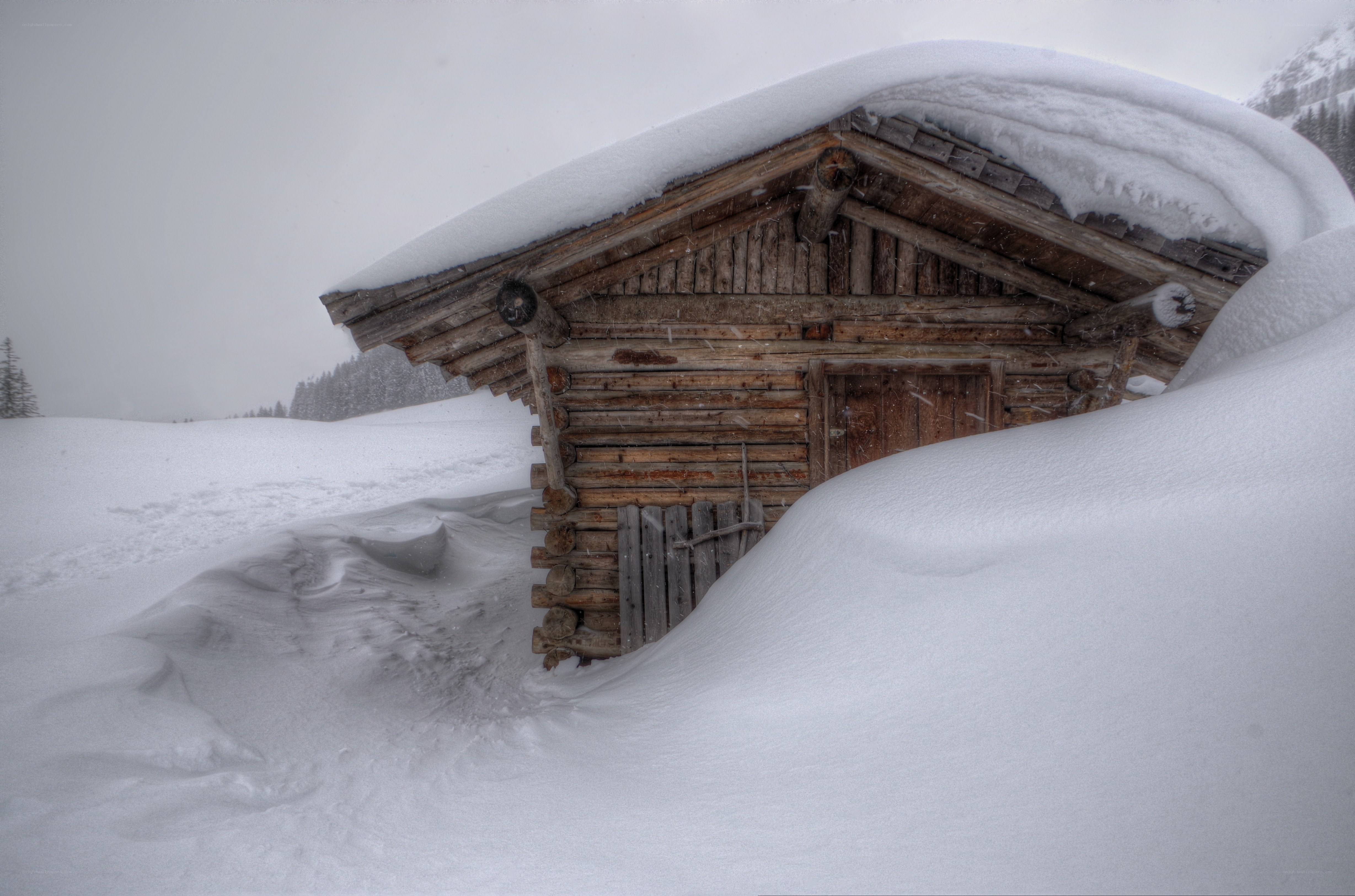 Snow-covered cabin in winter