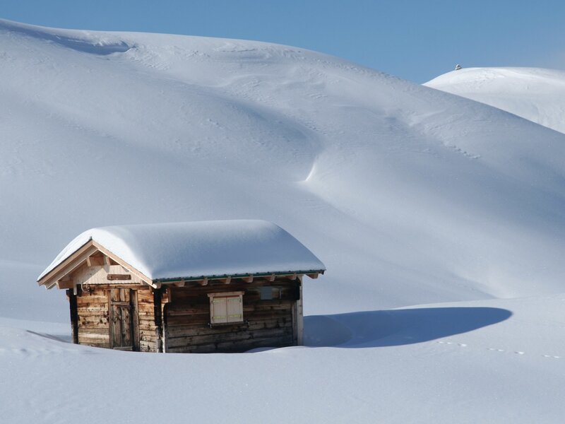 Snow-covered cabin in winter