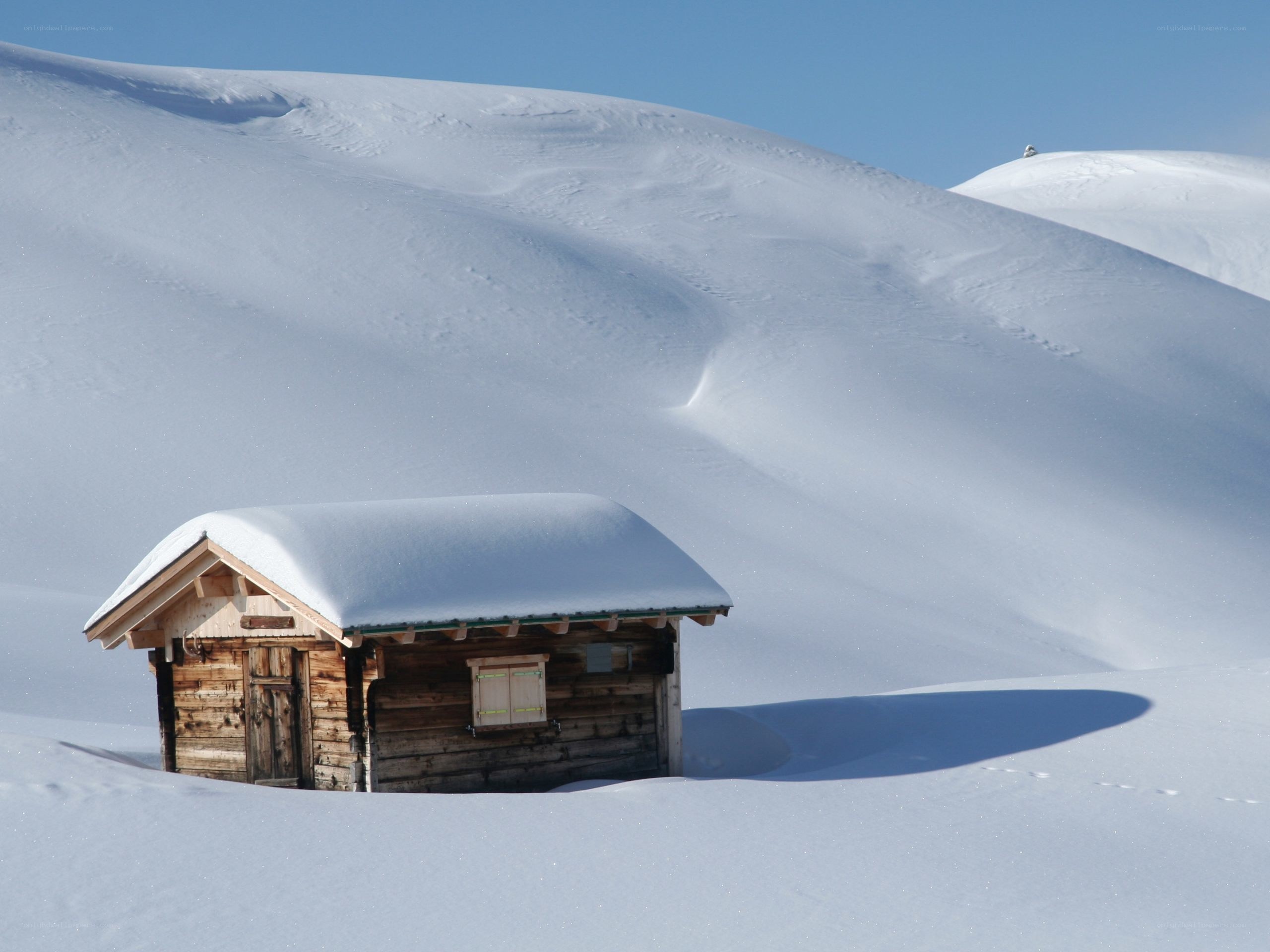 Snow-covered cabin in winter