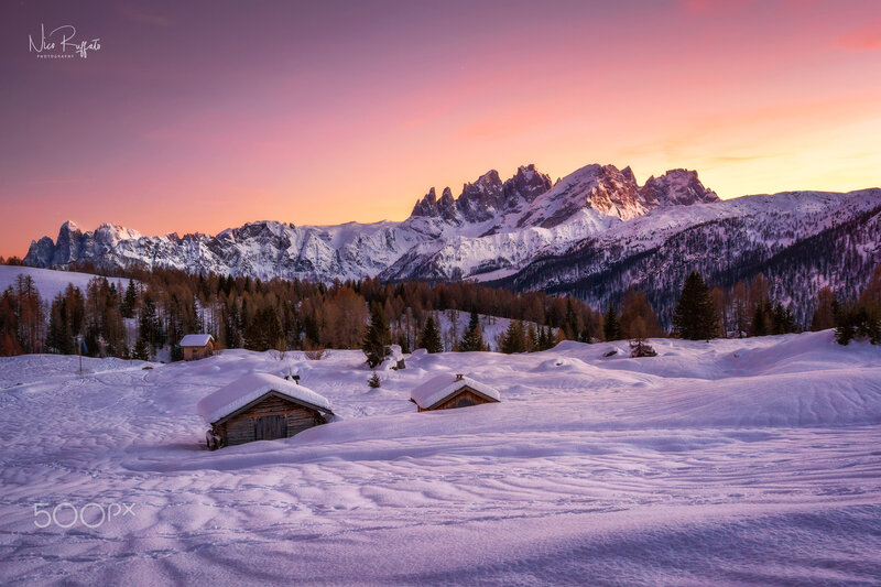 Snow-covered Cabins in Mountains — Pink