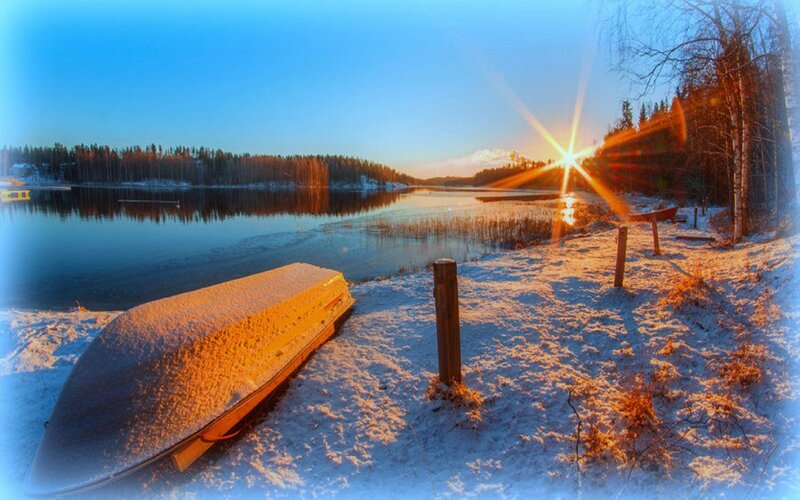 Snow-covered Canoe on Shore