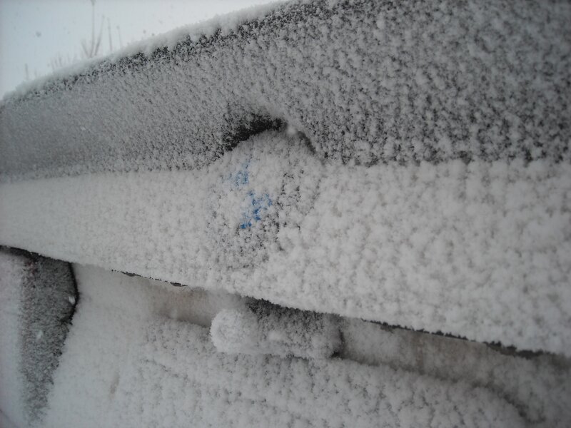 Snow-covered Car Door Handle
