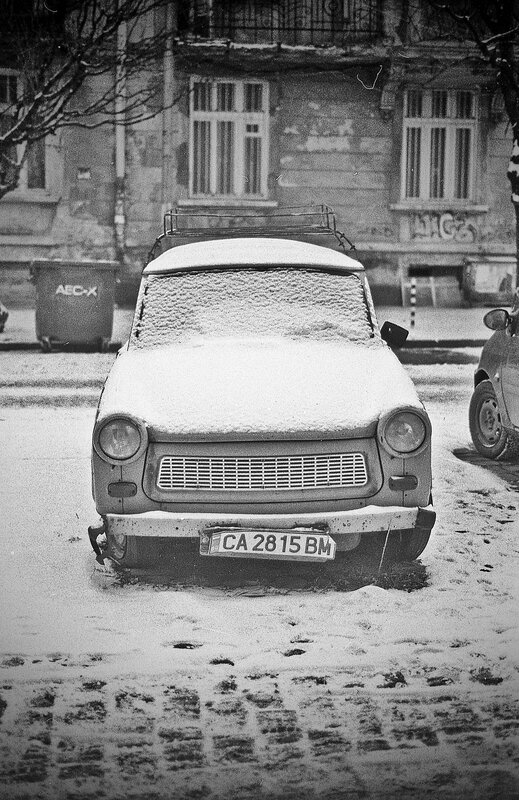 Snow-covered car in winter