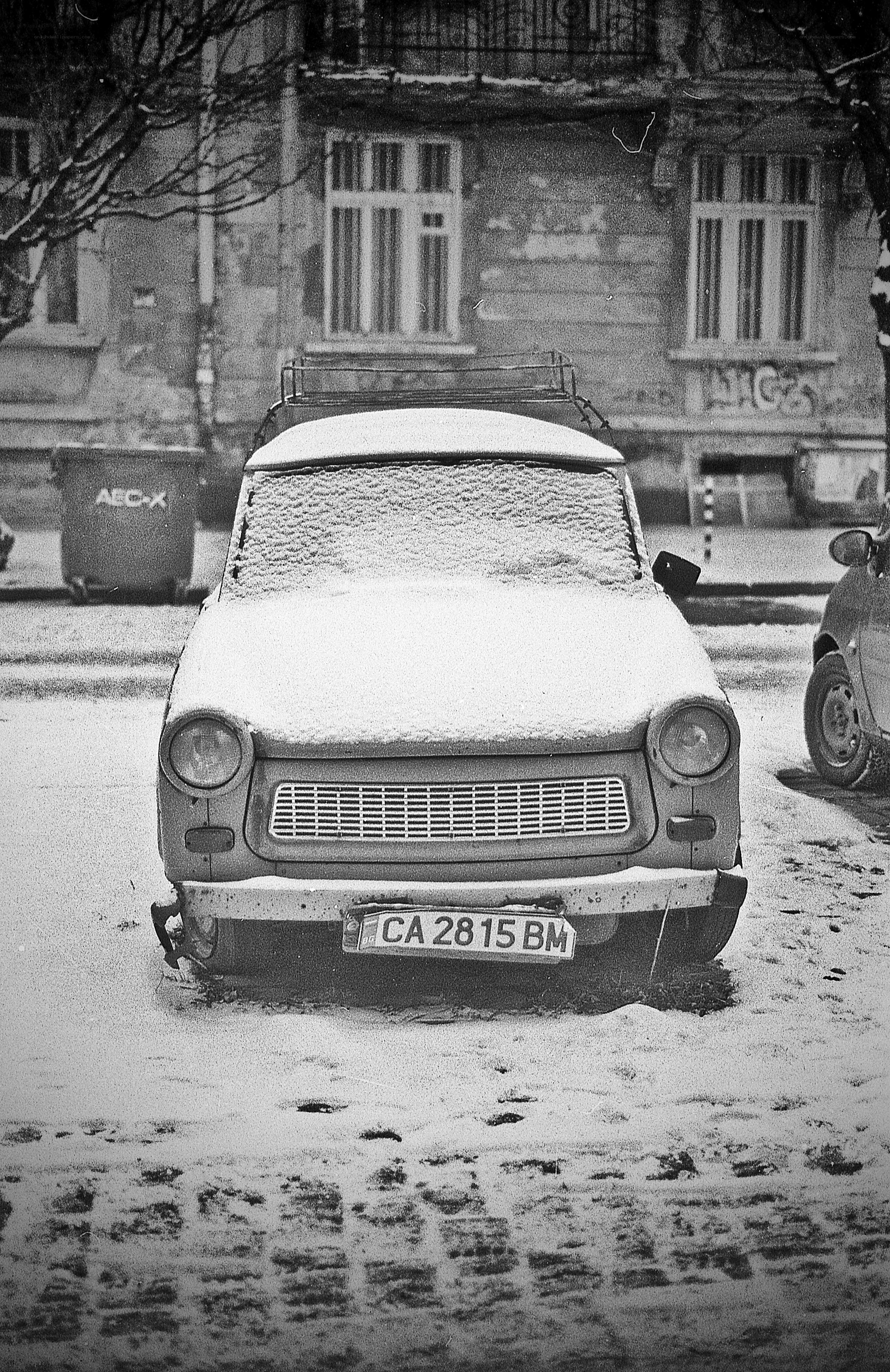 Snow-covered car in winter