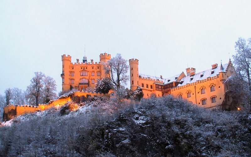Snow-covered castle at dusk