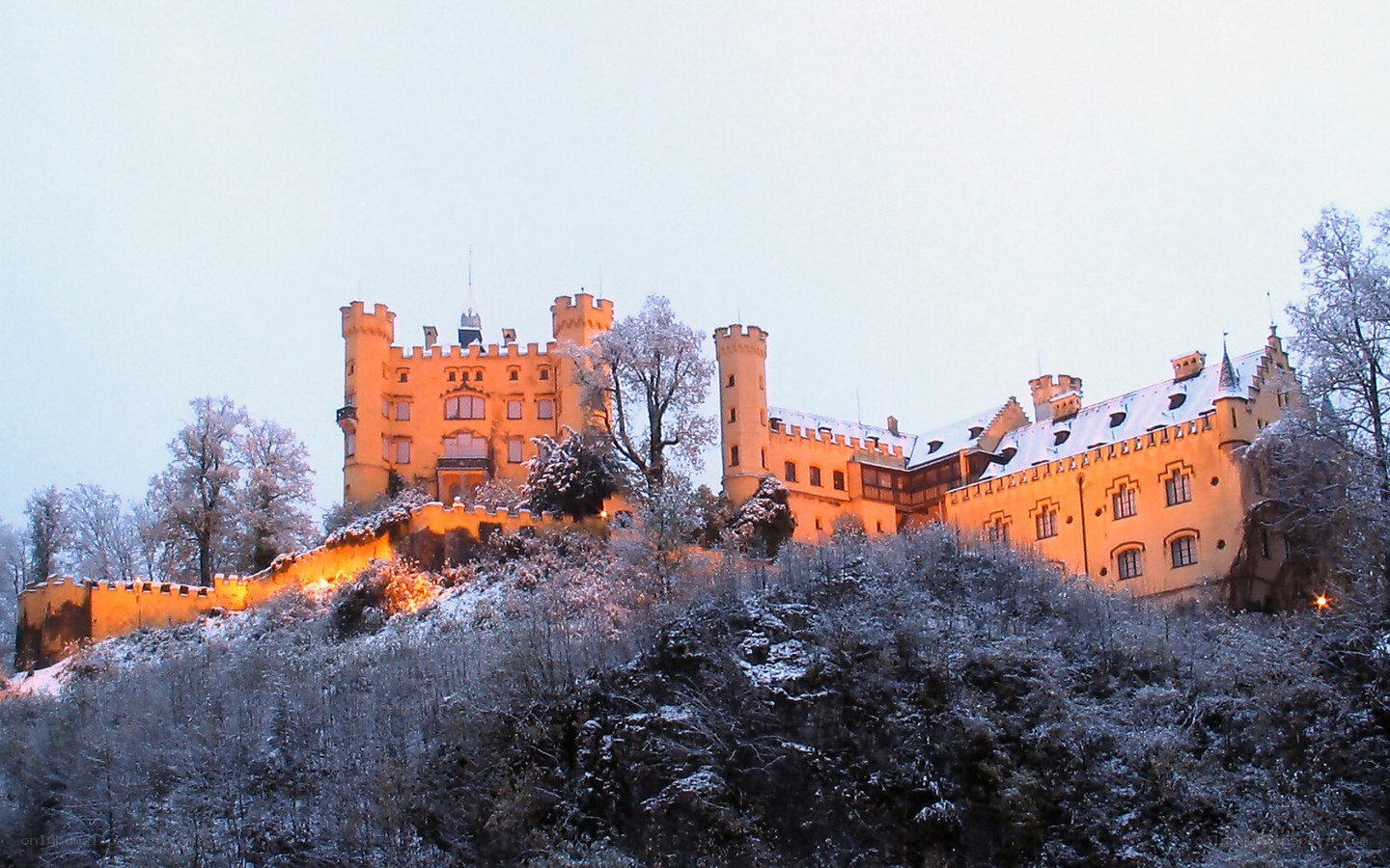 Snow-covered castle at dusk