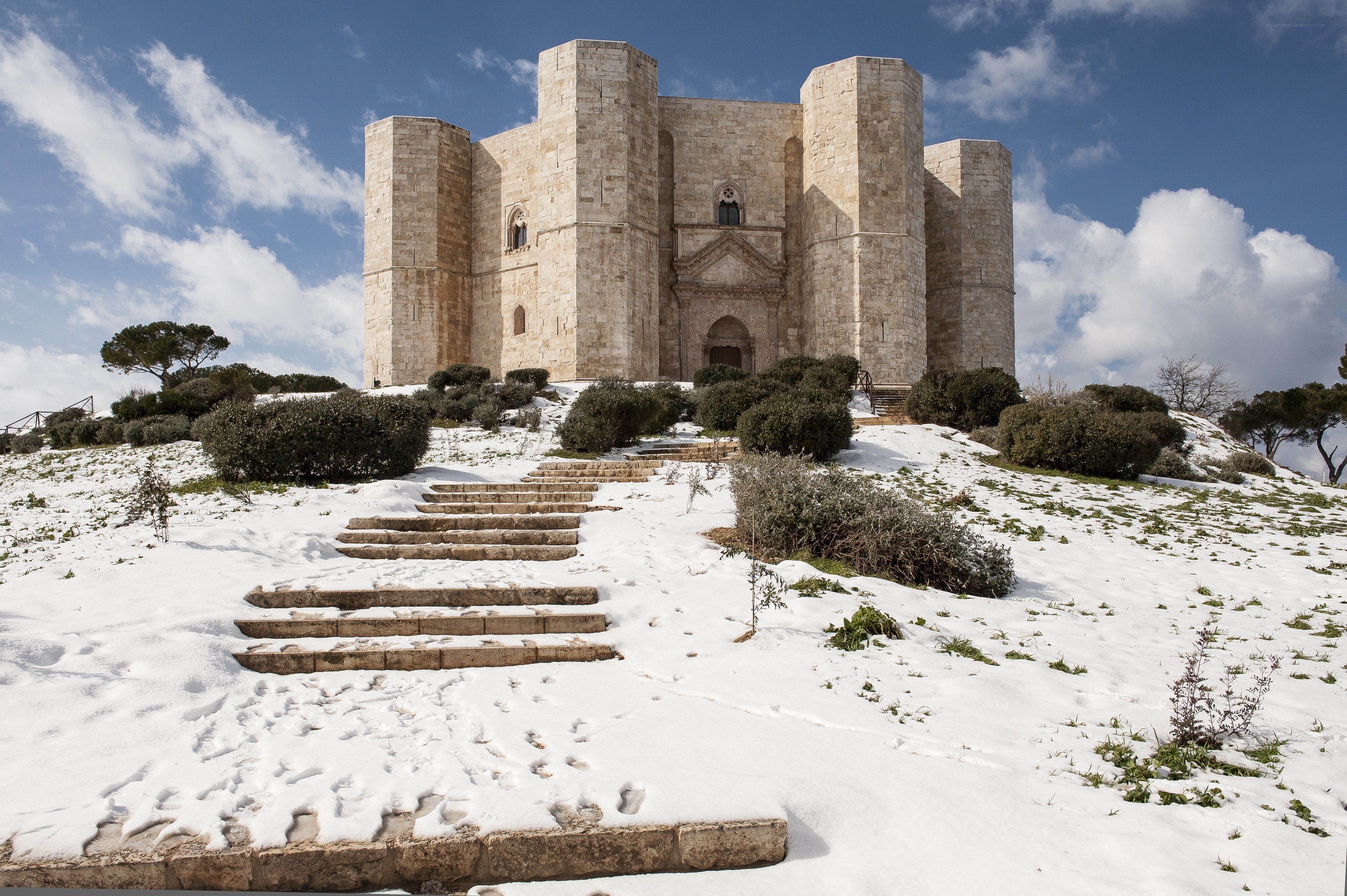 Snow-covered castle on a hill