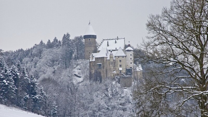 Snow-covered castle on a hill