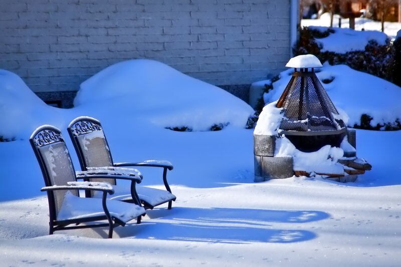 Snow-covered Chairs and Fire Pit