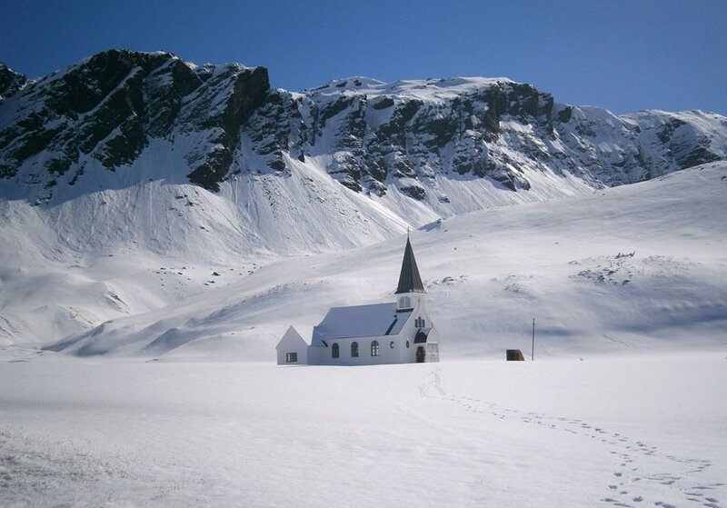 Snow-covered church in mountains