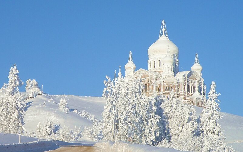 Snow-covered church on a hill