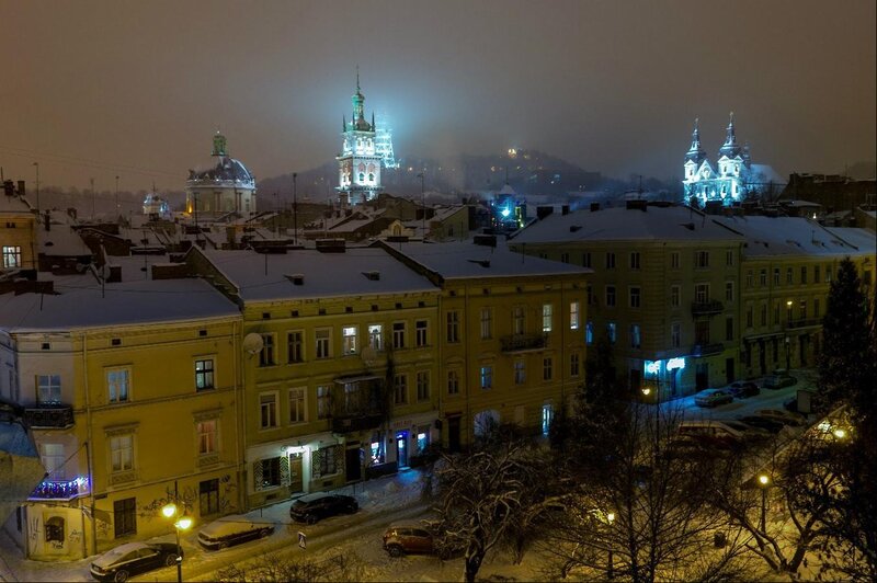 Snow-covered City at Night — Yellow