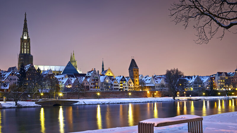 Snow-covered City Skyline — Purple