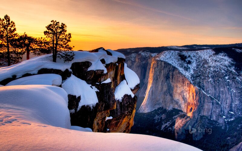 Snow-covered Cliff at Sunset — Orange, Serene
