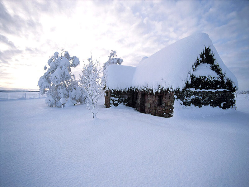 Snow-covered cottage in winter