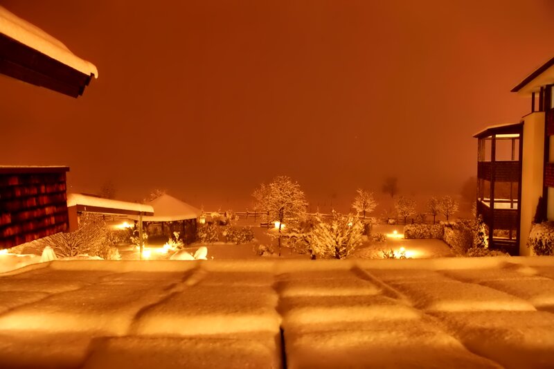 Snow-covered Courtyard at Night