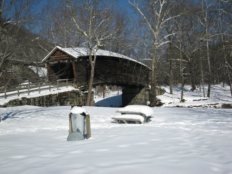 snow-covered covered bridge