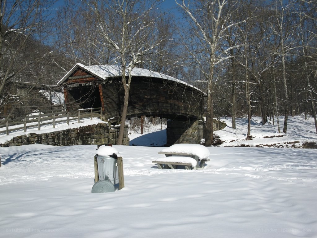 snow-covered covered bridge