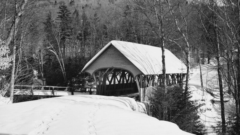 snow-covered covered bridge