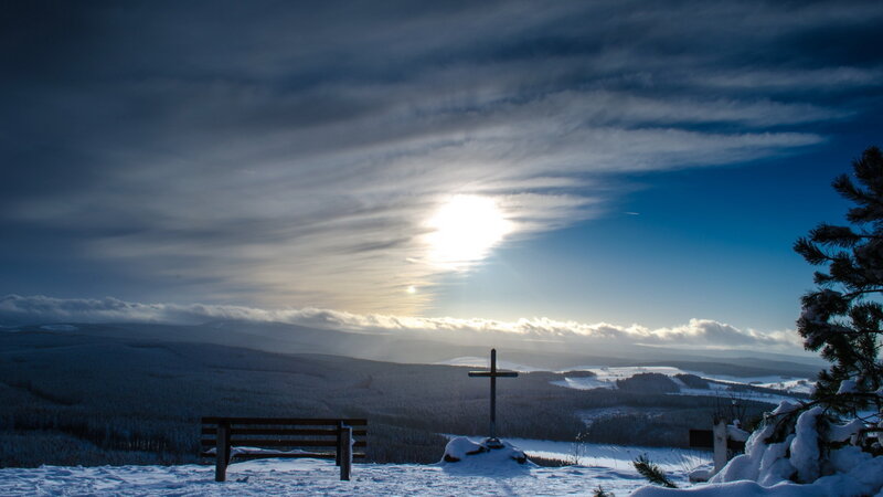 Snow-covered Cross on Hill