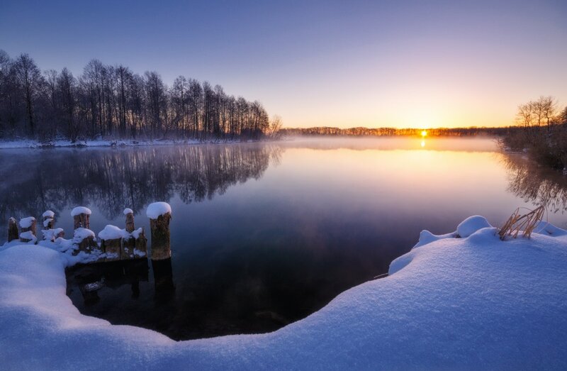 Snow-covered Dock at Sunrise