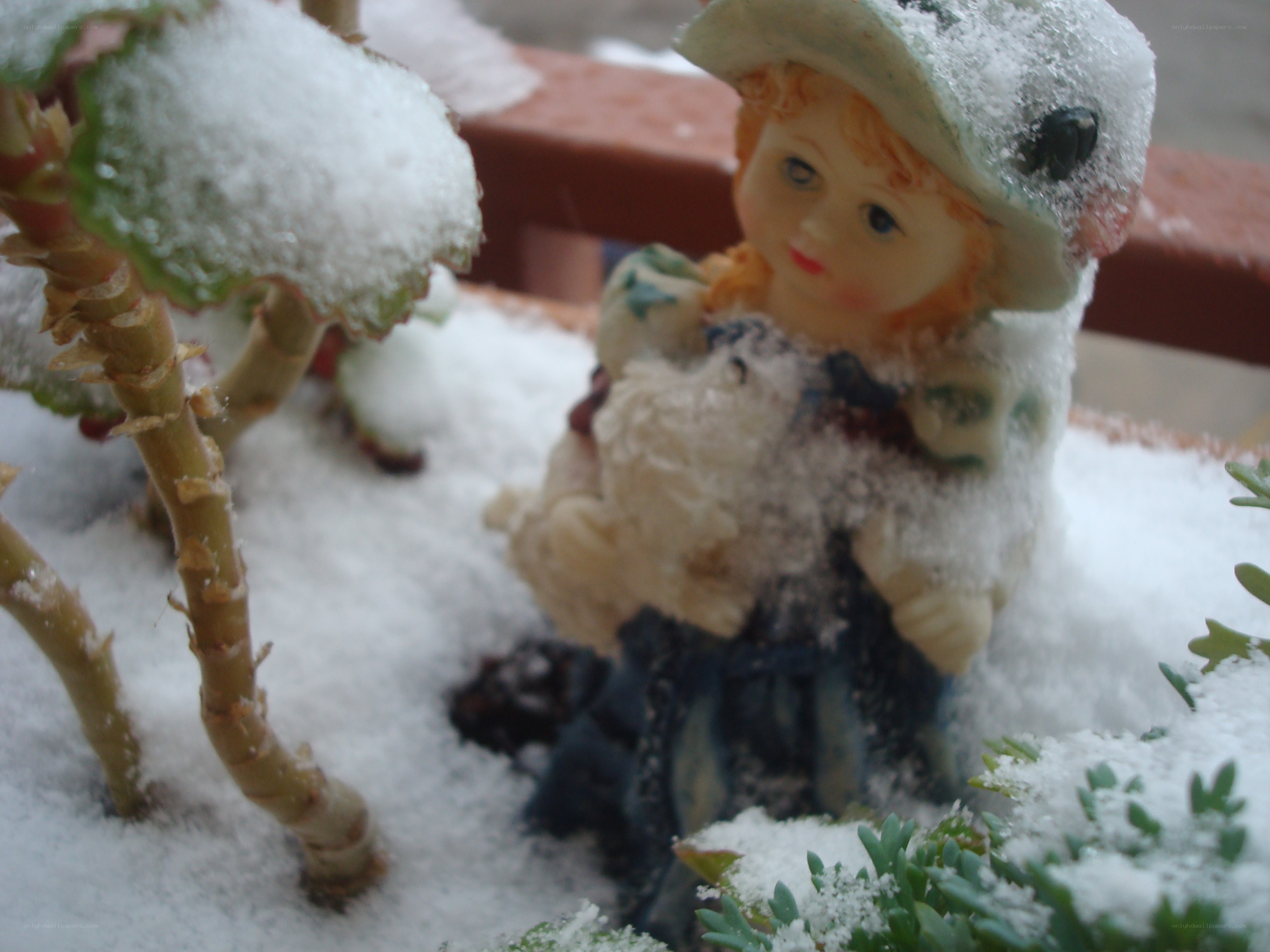 Snow-covered doll figurine