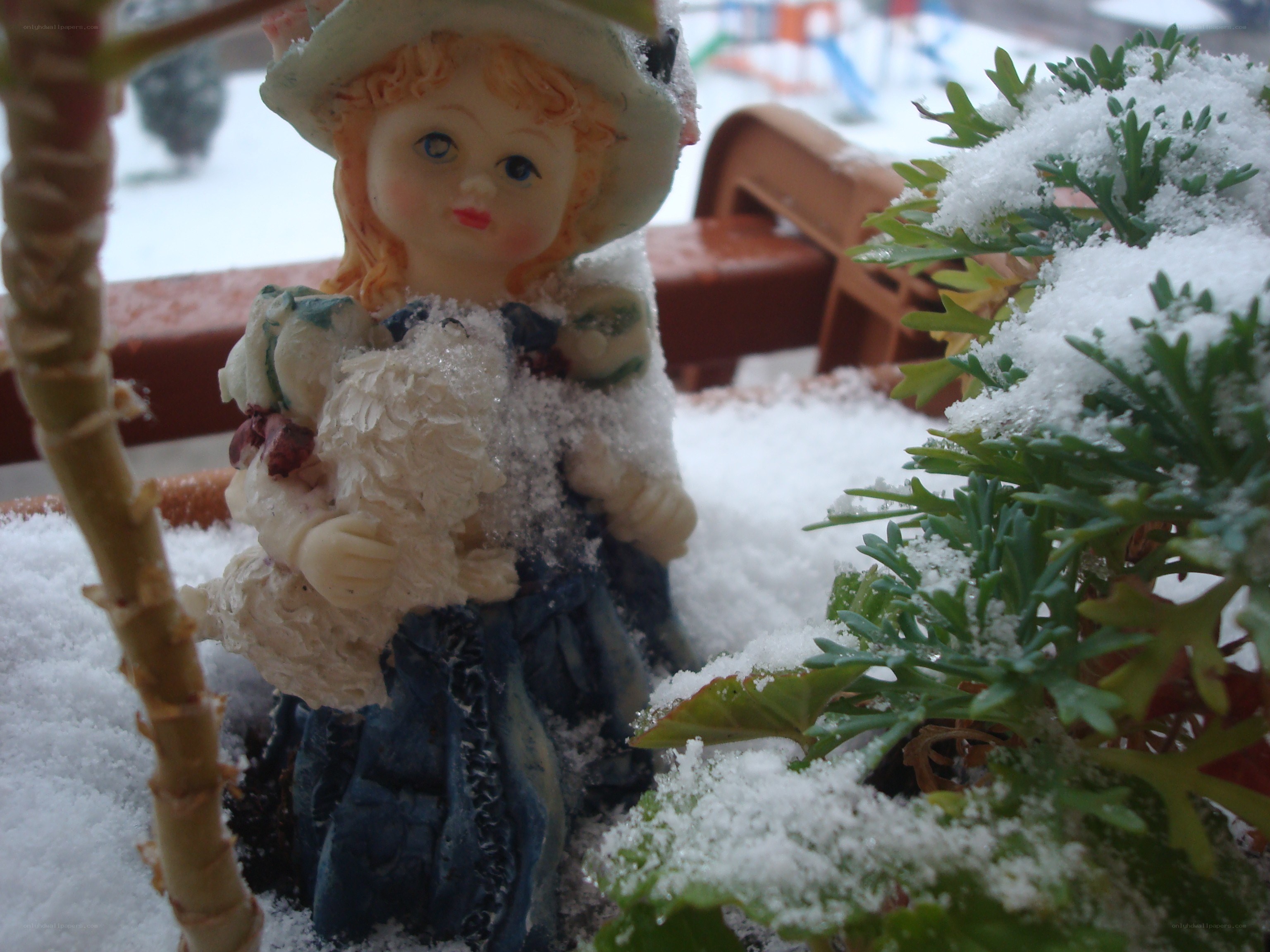 Snow-covered doll figurine