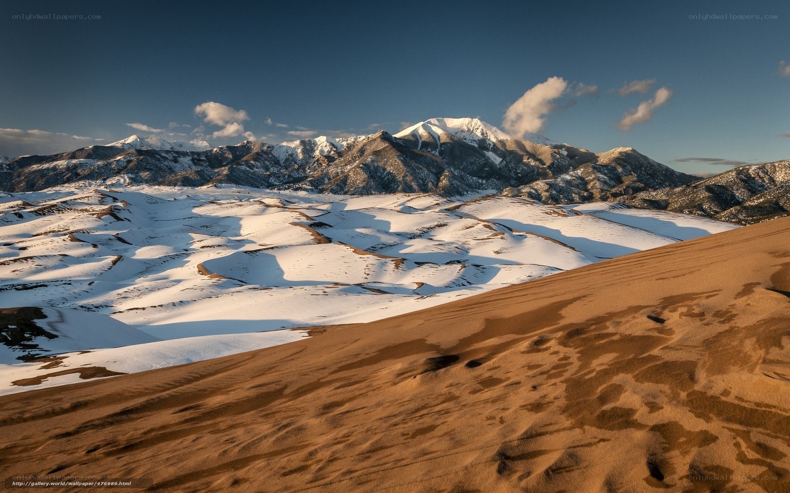 Snow-covered dunes and mountains