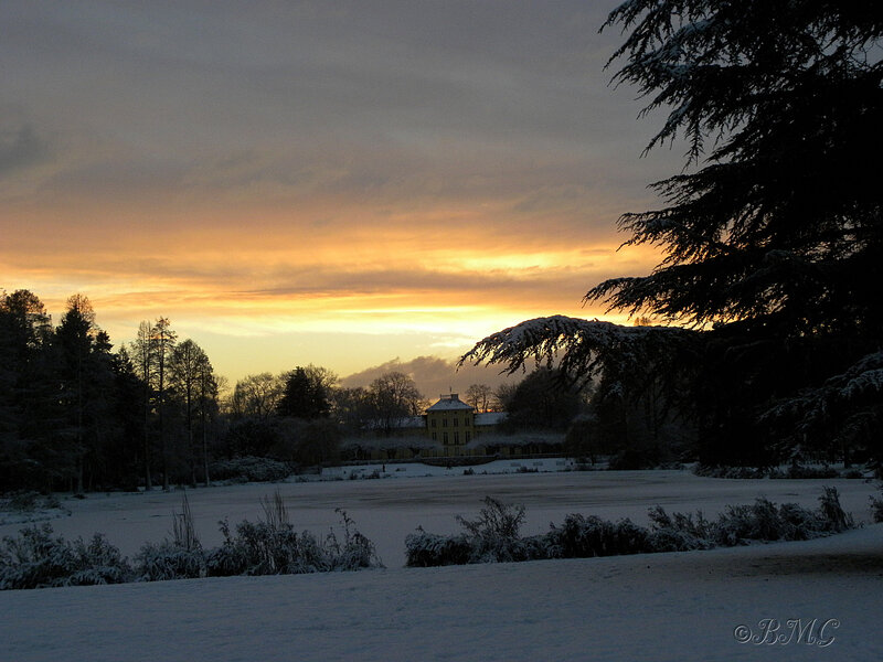 Snow-covered Estate at Sunset