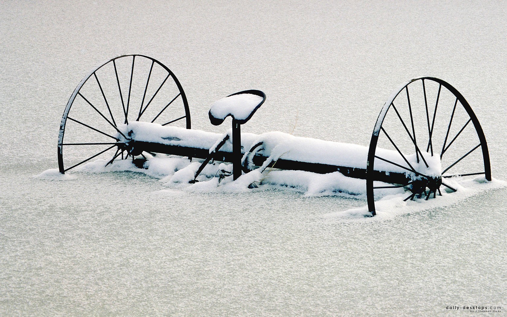Snow-covered farm equipment