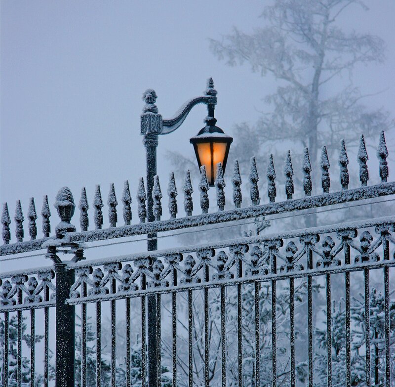 Snow-covered Fence and Lamp