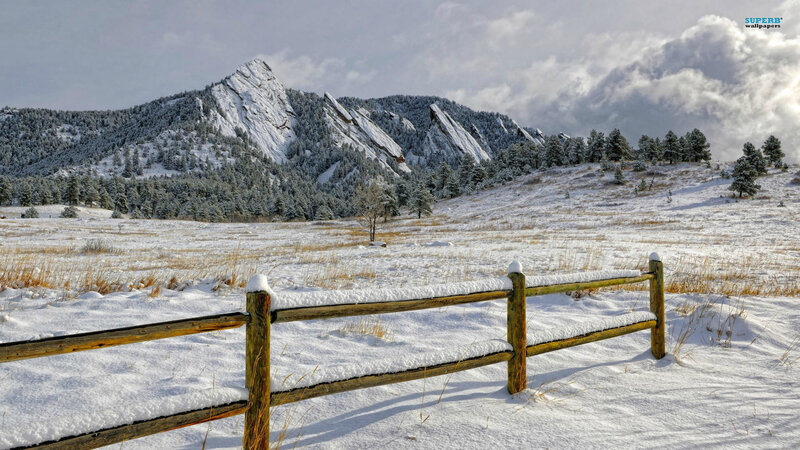 Snow-covered Fence and Mountain