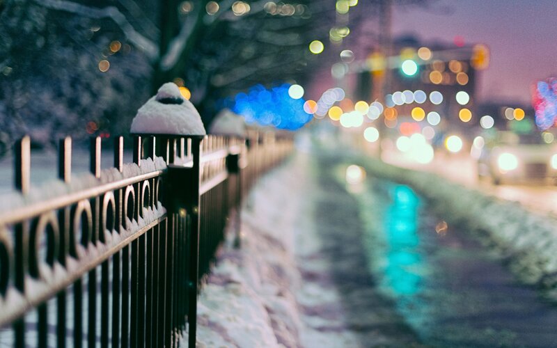 Snow-covered Fence at Night