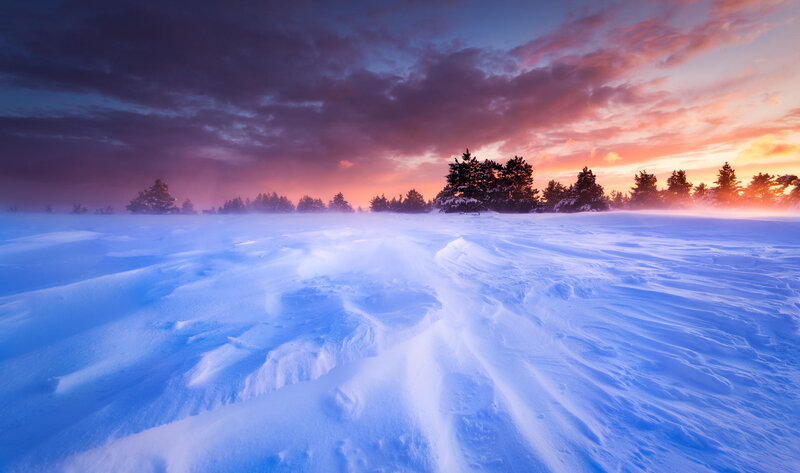 Snow-covered Field at Sunset — Blue, Dramatic, Photograph