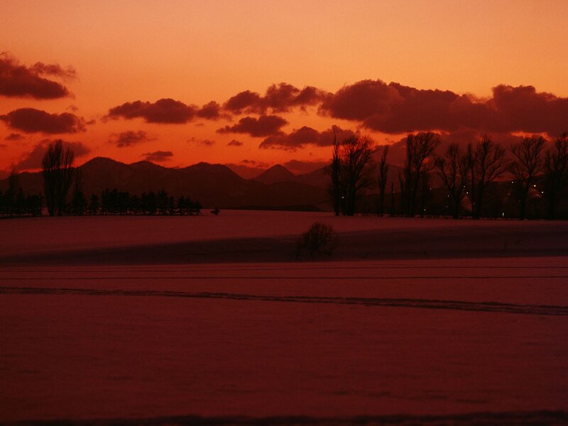 Snow-covered Field at Sunset — Red, Dramatic