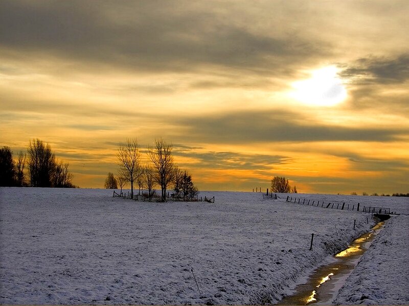Snow-covered Field at Sunset