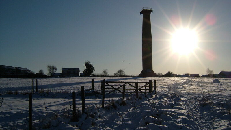 Snow-covered Field with Tower
