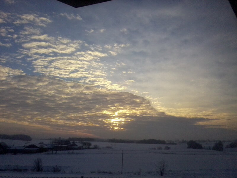 Snow-covered Fields at Sunrise