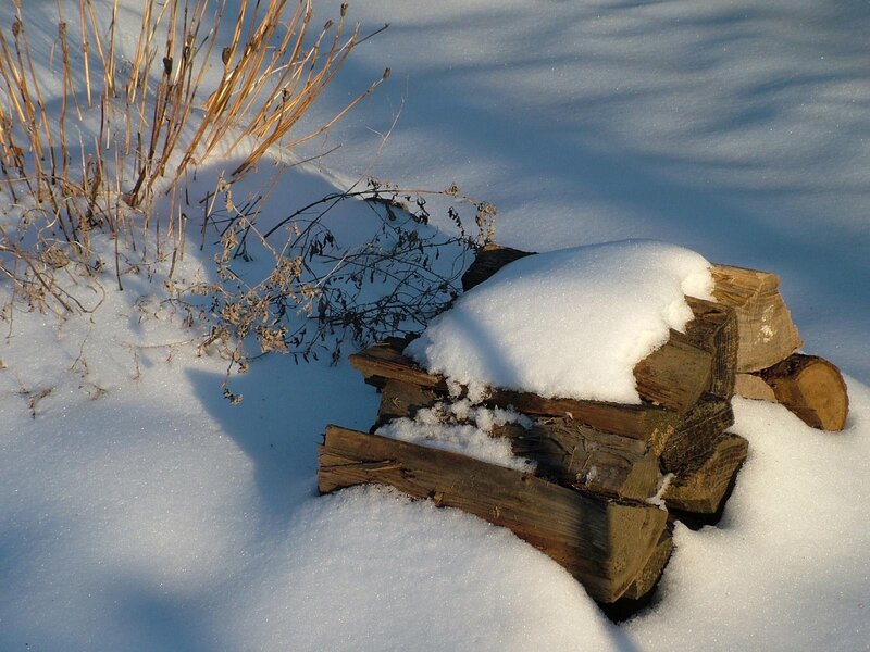 Snow-covered firewood stack