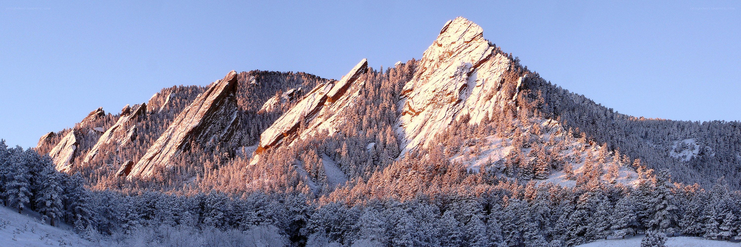 Snow-covered Flatirons at sunrise