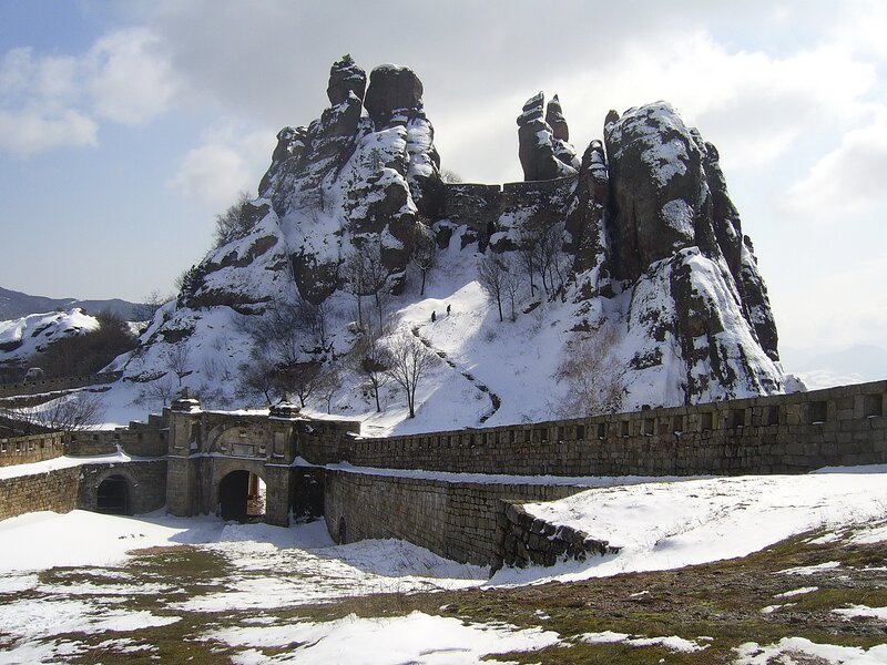 Snow-covered fortress on rocky hill