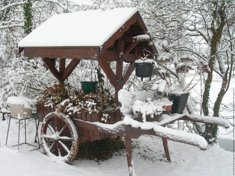 Snow-covered Garden Cart