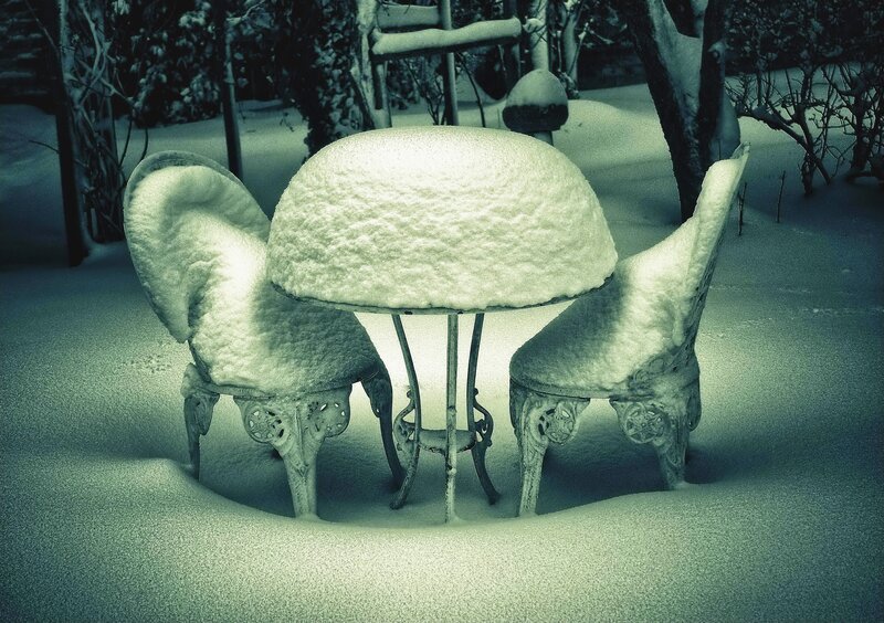 Snow-covered garden furniture