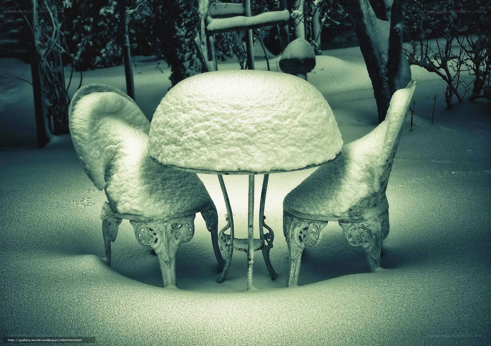 Snow-covered garden furniture