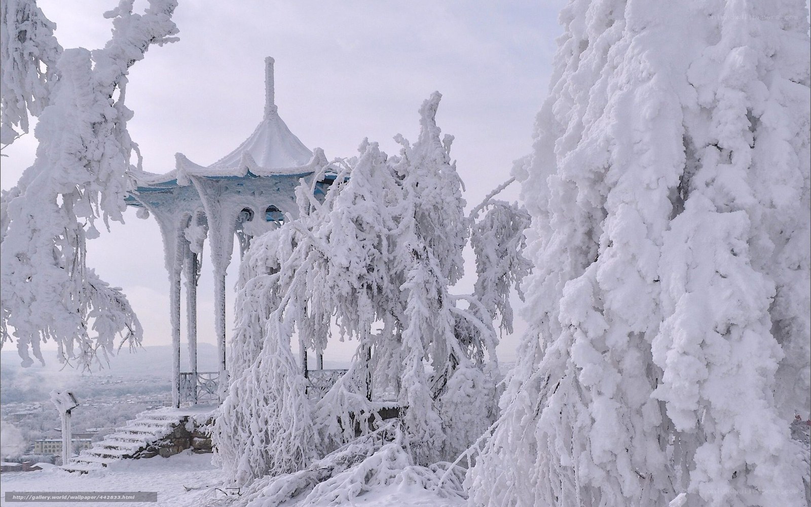 Snow-covered gazebo in winter
