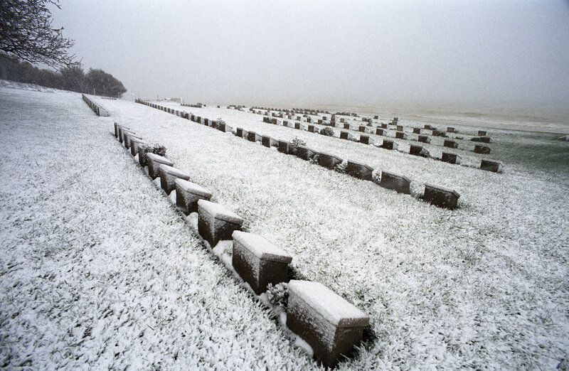 Snow-covered graves at a war cemetery