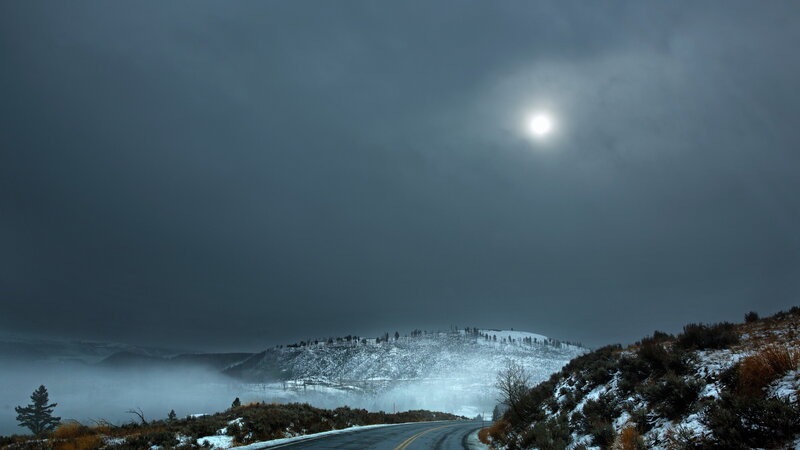 Snow-covered Hill at Night